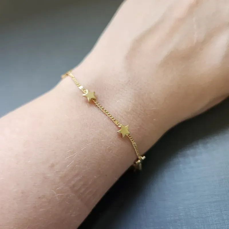 PULSEIRA OURO ESTRELAS CHAPADOS